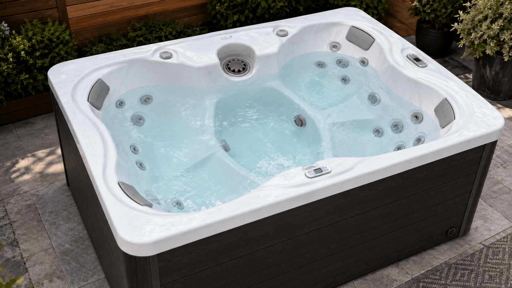 Open hot tub cabinet showing pumps and service components