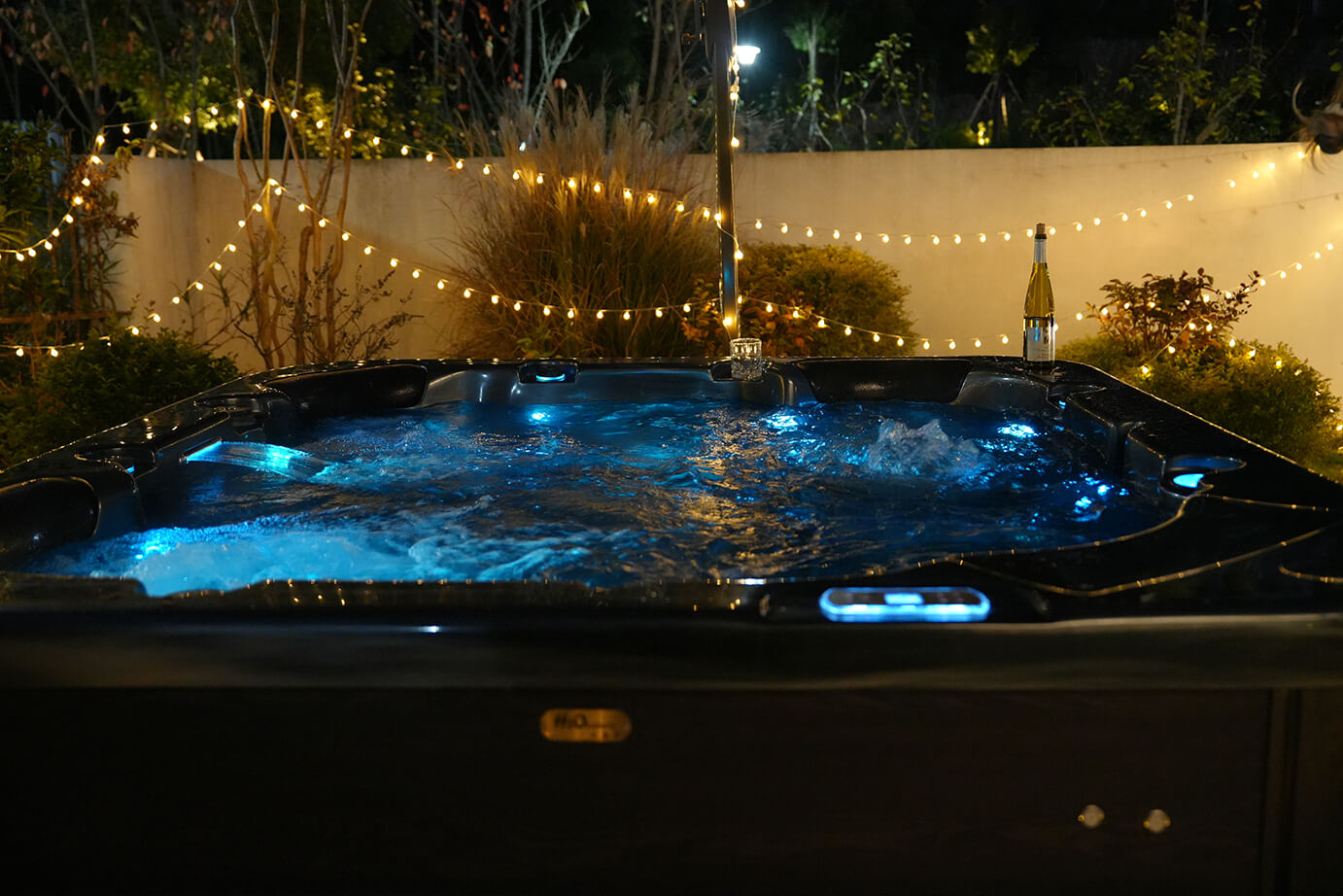 Outdoor hot tub illuminated at night